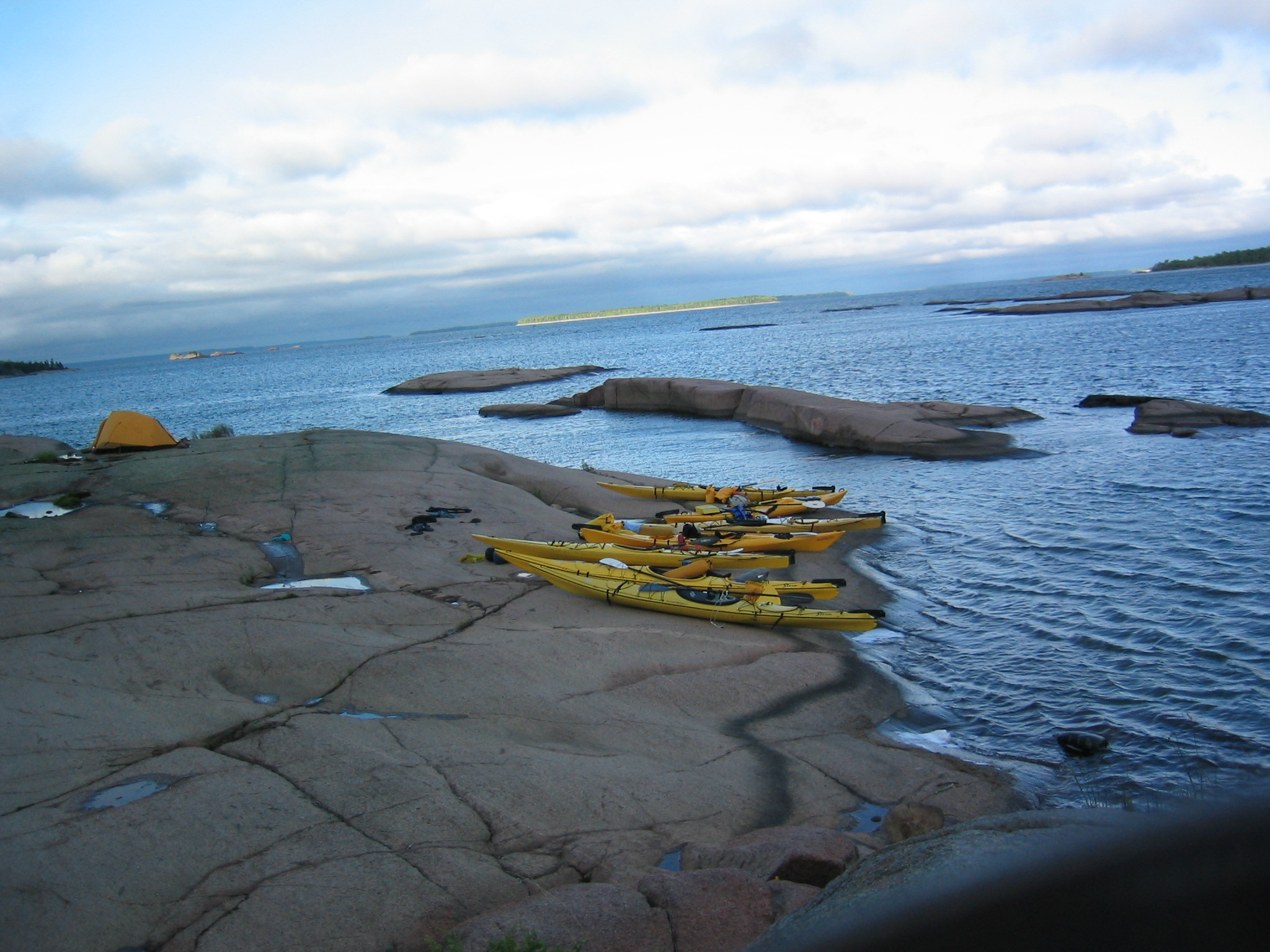 Kayaks and tent